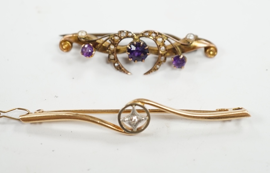 An Edwardian 15ct and diamond set crossover bar brooch, 57mm, gross weight 3.9 grams, together with a similar 9ct gold, amethyst and seed pearl set bar brooch, gross weight 2.3 grams. Condition - fair